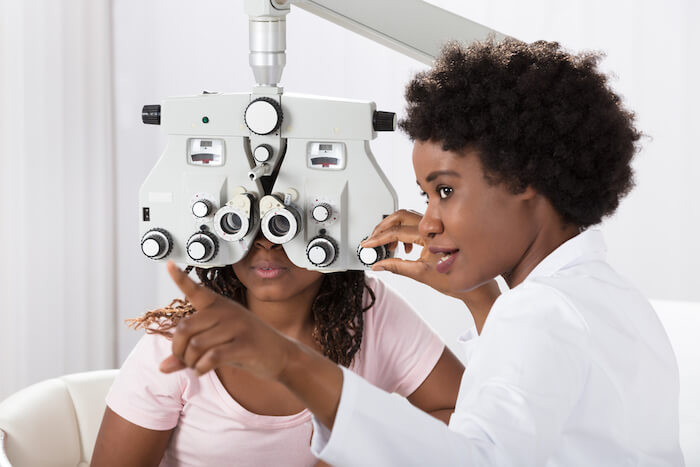 Optometrist giving an eye exam